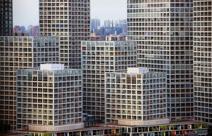 À Pékin, Jian Wai Soho désigne un ensemble de neuf tours résidentielles et quatre « small office home office » (SOHO), des espaces mixant logements et locaux d’activité.